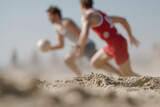 dynamic scene of beach handball with portrait on left side random emotion