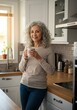 © Nurbaity - Woman with mug standing in kitchen