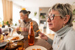 © Westend61 - Family enjoying a meal together at home during the weekend