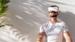 © Arfin - Man Wearing Vr Headset with Shadow on White Wall