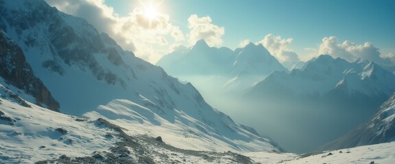 Poster - Majestic snow-covered mountain range with the sun shining through the clouds, creating a serene and expansive landscape