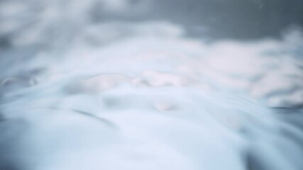 Wall Mural - super slow motion detail shot of water drop and waving clear water surface at 1000fps.