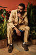 © Bliss - Dapper gentleman enjoying summer vibes in stylish warm tones and lush greenery