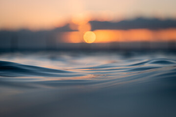 Wall Mural - Calm ocean surface at dawn.