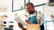 © peopleimages.com - Barista, tablet and manager with black man in cafe for research, digital inventory or restaurant supply checklist. Waiter, catering review and small business with person in coffee shop for menu