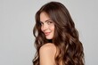 © firdan - Woman's Luxurious Brown Wavy Hair: A Portrait of Beauty