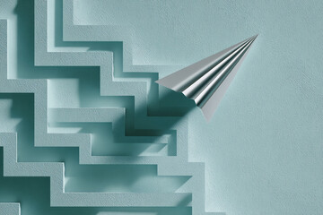 Poster - silver paper airplane above teal maze, symbolizing problem-solving, innovation, and finding a way ou
