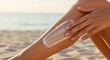 © Farhan - Applying sun protection on a sunny beach for optimal skincare