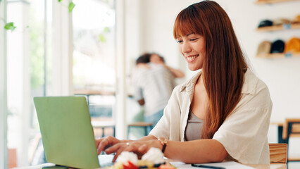 Fototapete - Coffee shop, remote work and woman on laptop in cafe for online project, research report and website, Professional, freelancer and person on computer in restaurant for breakfast, meal and break