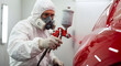 © abu - Man in White Suit Spraying Red Car with Precision in Bright Automotive Booth for Repair and Paint Service