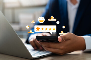 Canvas Print - Consumer use smartphone to complete online customer satisfaction survey, rating 5 stars for excellent service and product quality. Positive feedback help increase brand business reputation.