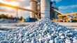 © Chirayu stock - cement facility in golden hour lighting, architectural focus on symmetry between twin processing towers, smooth geometric walls, gravel surface in foreground, no visible machinery operators