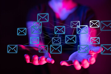 Leinwandbilder - Person's hands holding a network of email icons, symbolizing global communication and connectivity.