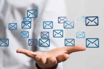 Leinwandbilder - Hand holding network of email icons.  Digital communication, global network, internet connectivity.
