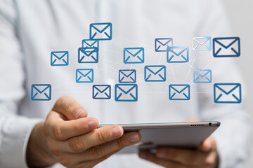 Fototapete - Person using tablet to manage multiple emails.  Efficient inbox management concept.
