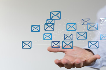 Fototapete - Hand holding digital email icons,global communication, network, connection, technology concept.