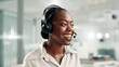 © FremtonClay/peopleimages.com - Happy, black woman and consultant with headset at call center for online communication or customer service. Female person, agent or smile with technology, mic or help for virtual assistance at office
