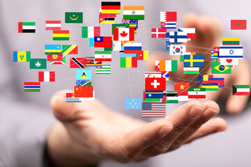 Fototapete - Image of hands holding a network of interconnected flags representing global collaboration and international relations.