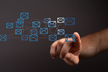 Aufkleber - Hand interacting with a network of email icons, symbolizing global communication and connectivity.
