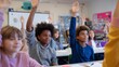 © fotofabrika - Students eagerly participating in a class discussion in a bright, vibrant classroom setting during the morning hours