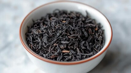 Poster - A simple setting featuring a white bowl filled with black tea on a table, perfect for a quiet moment or as a prop in a scene