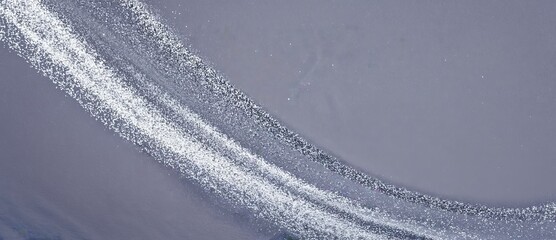 Poster - Swirling patterns of white and gray create an abstract landscape reminiscent of soft waves