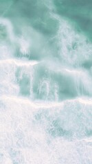 Wall Mural - Serene Aerial View of Gentle Ocean Waves Meeting Soft Shoreline on a Bright Sunny Day Capturing Tranquility in Nature's Colors and Textures