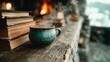 © Factory Stock - Cozy beverage with books by fireplace