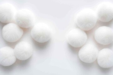 Poster - Fluffy white pom poms arranged symmetrically on white background