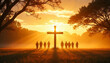© Anastasiia - Silhouettes of people standing near cross at sunset in a misty field