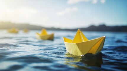 Poster - Three yellow paper boats float gently on calm blue water, bathed in sunlight.