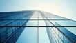© Berkah - Abstract view of a modern glass skyscraper reaching towards the sky