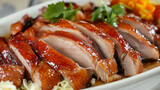 A plate of fresh and delicious roast duck on a table, Chinese cuisine