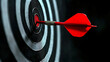 © Poramet - Business marketing success concept. The red dart arrow bullseye in the middle of the dart paper is the goal of the business.