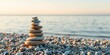 © rattana - Serene beach pebble tower, balancing stones symbolize inner peace and well-being, beach,  sand