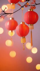 Poster - Vertical video of Red lanterns with gold tassels hang from branch with blossoms, glowing softly against festive bokeh background, creating warm
