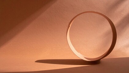 Poster - Rolling wooden cylinder in soft light minimalist studio artistic photography warm tones abstract view