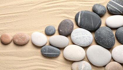 Poster - Arranging natural pebbles in soft sand beach landscape aesthetic photography calm environment top-down view