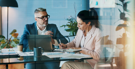 Poster - Documents, laptop and business people in office with meeting for company investment deal. Computer, paperwork and finance manager with investor client for discussion with dividend report in workplace