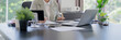 © mojo_cp - Young asian woman secretary working with laptop at contemporary office