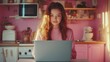 © Aisha - Positive online learning experience, young woman using simple laptop, kitchen interior
