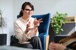 © Andrii Zastrozhnov - Female therapist engaging with client in comfortable office setting