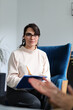 © Andrii Zastrozhnov - Young caucasian female therapist listening to client during counseling session