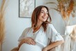 © Ольга Лукьяненко - Smiling pregnant woman at fertility clinic consultation