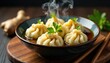 © Sathaporn - Steaming bowl of dumplings, chopsticks, ginger, beef, wonton, pork