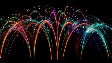 Vibrant, colorful fireworks burst against a dark night sky. Festive.