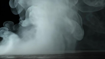 Poster - Ethereal Smoke Swirls in Artistic Display Over Dark Background for Creative Projects