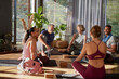 © Rido - Group of multiethnic friends talking after yoga lesson