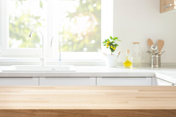Wall Mural - wood table top for product montage on blur kitchen sink and window interior background