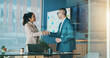 © peopleimages.com - Shaking hands, welcome and business people in office for partnership, collaboration or finance agreement. Meeting, deal and financial manager with client for handshake with investment contract.